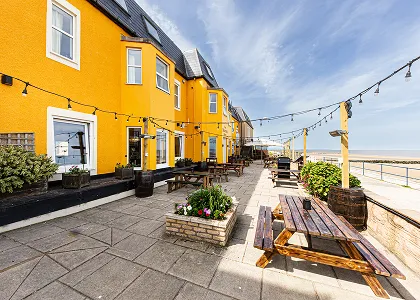 Yellow coastal hotel exterior 